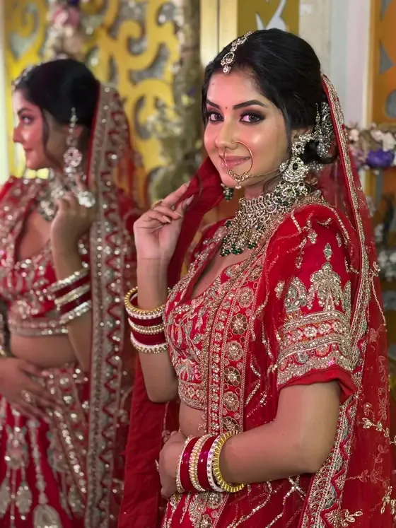Bride in red reflected in the studio mirror