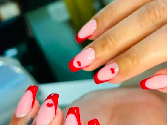 Red French tips with painted hearts